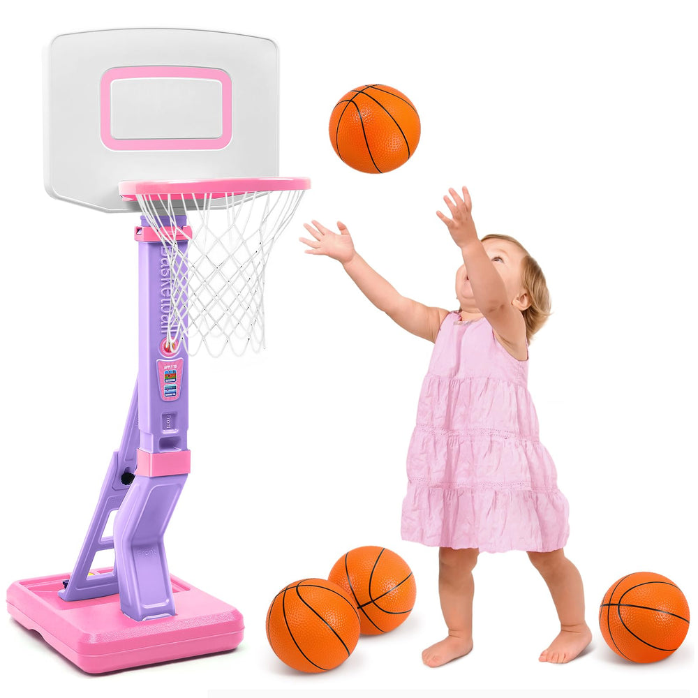 Child playing with a toy basketball hoop and balls on a white background