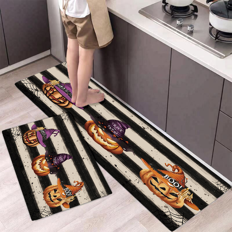 Halloween-themed kitchen mats with pumpkins and witches&