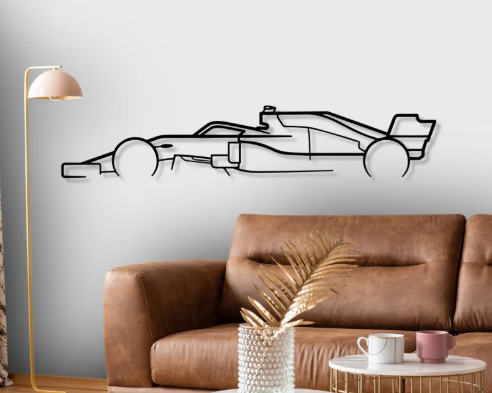 Living room with a brown sofa, decorative lamp, and wall decal of a racing car.